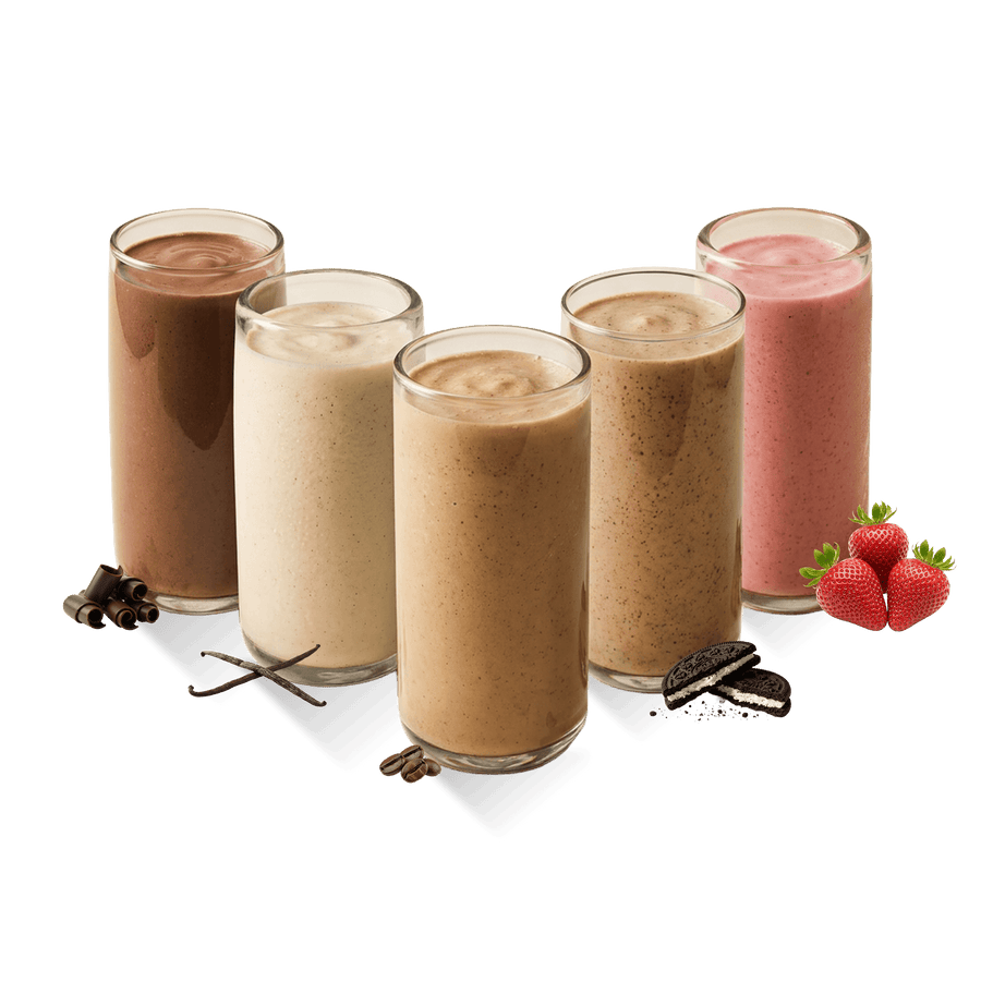Tall clear glasses filled with Shakeology in different flavors