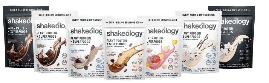 Six Shakeology protein powder pouches in assorted flavors. 